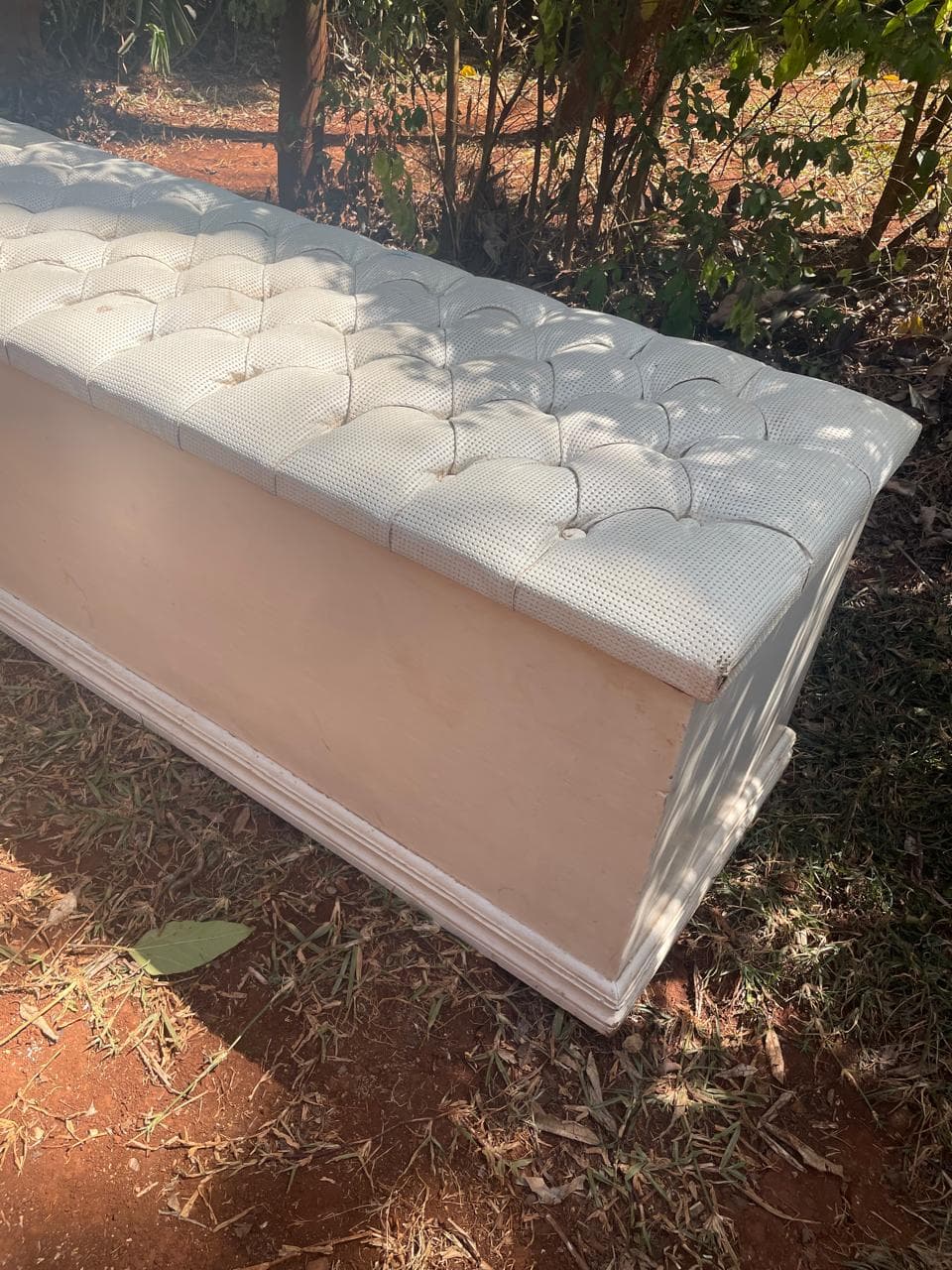 Tufted bedside ottoman